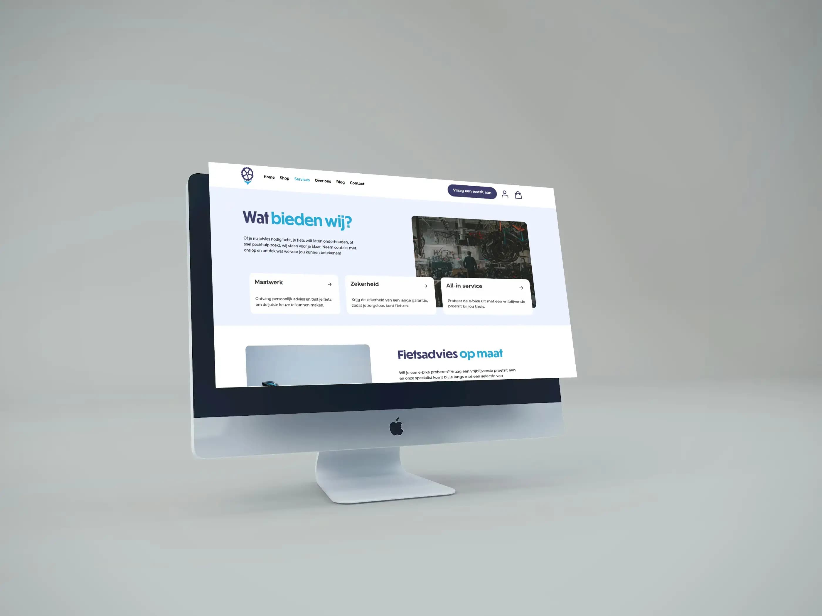 Desktop computer monitor showing a website with text, images, and navigation elements.